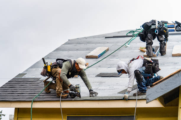 Professional Gutter Installation technician working in Baldwin, NY